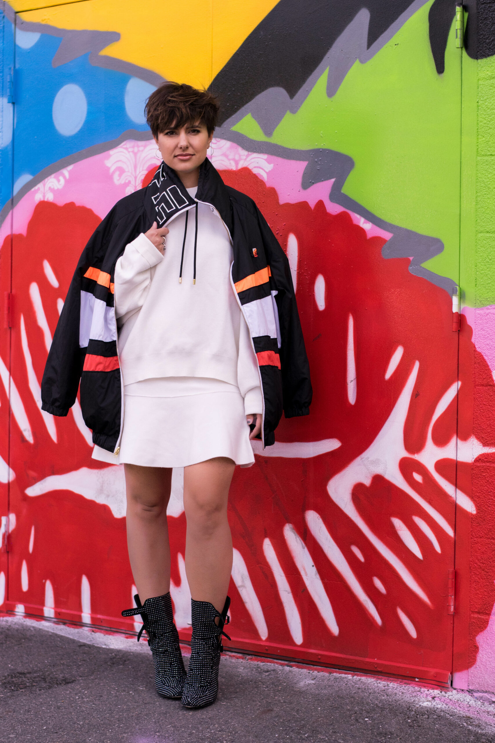 Why Your Sporty Windbreaker is the Perfect Topper for a Holiday Look
